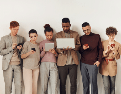 Photo of people looking at gadgets